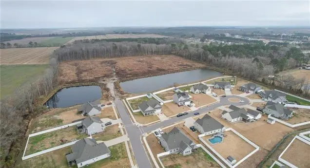 A view of houses and water from above.