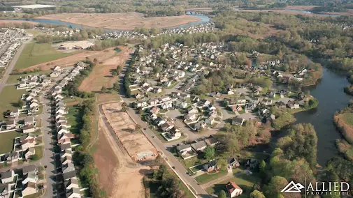 An aerial view of a residential area with lots of trees.