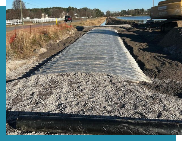 A large amount of sand is laying on the ground.